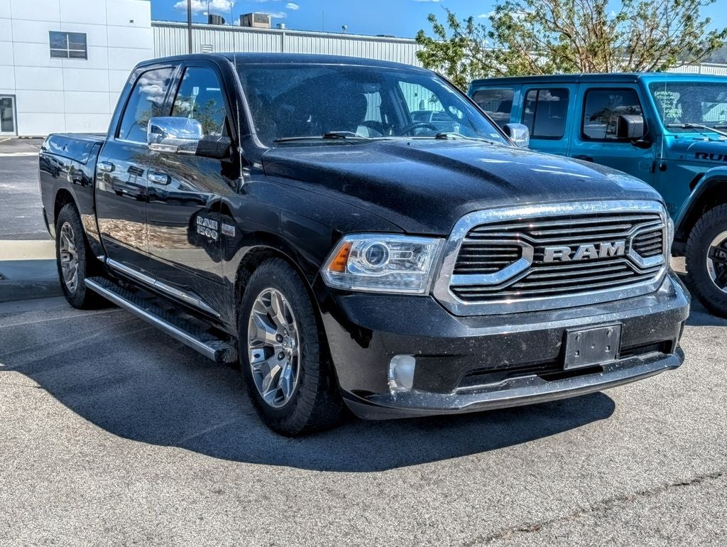 2017 RAM 1500 Laramie Longhorn in Brilliant Black Crystal Pearlcoat — front three-quarter view