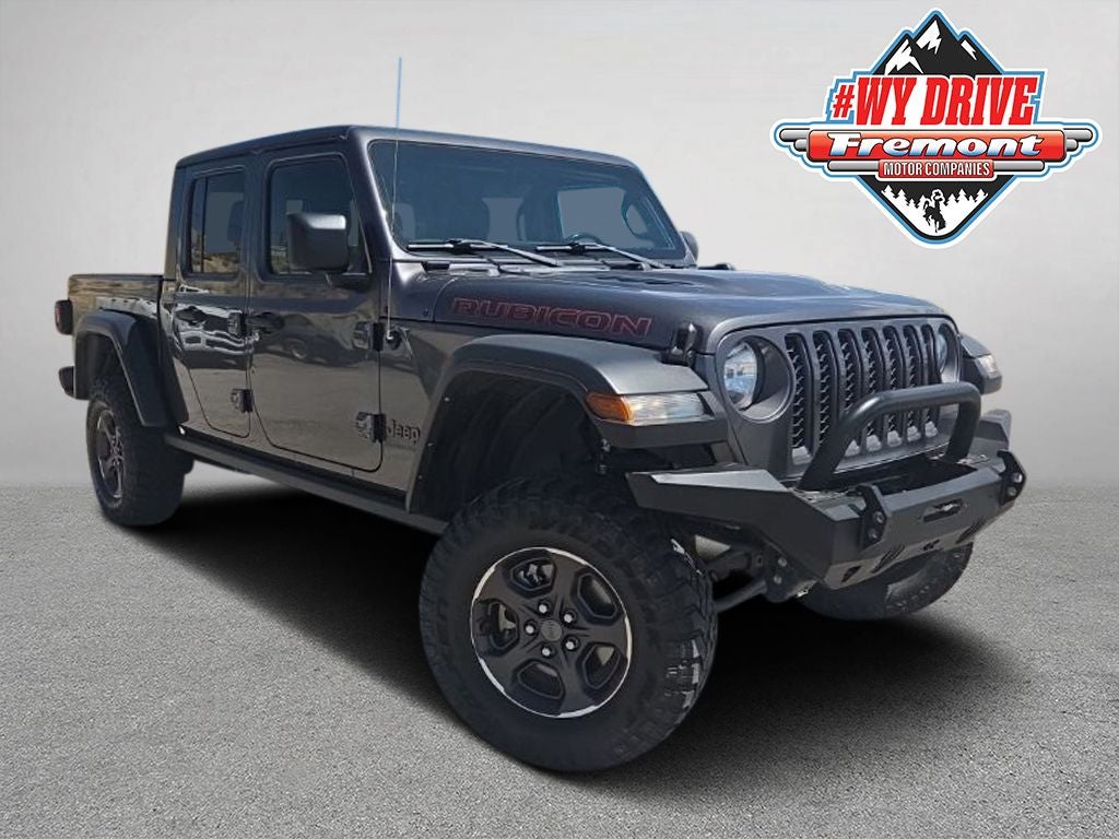 2022 Jeep Gladiator Rubicon in Granite Crystal Metallic Clearcoat — front three-quarter view