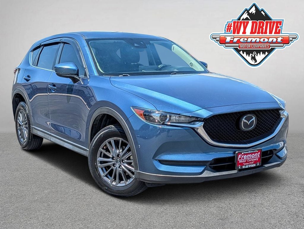 2021 Mazda Mazda CX-5 Touring in Eternal Blue Mica — front three-quarter view